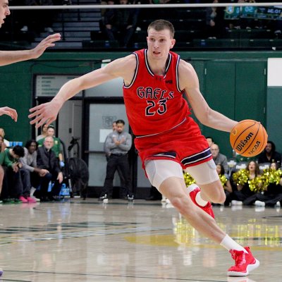 Basketball player Paulius Murauskas drives against USF in January 2026