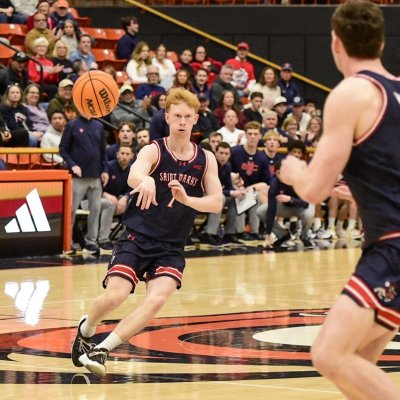 Basketball player Joshua Dent passes against Pacific in February 2026