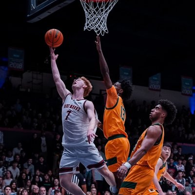 Basketball player Joshua Dent shoots against USF in February 2026