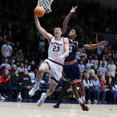 Basketball player Paulius Murauskas drives against Pepperdine in February 2026