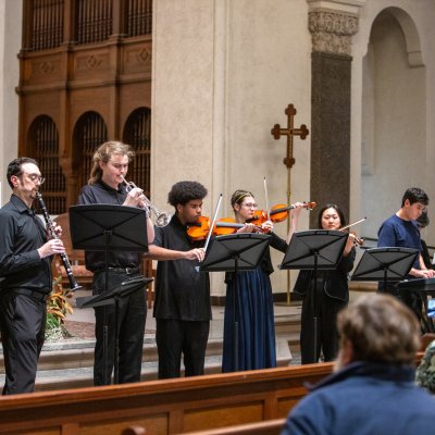 instrumental students play instruments on the altar in SMC's Chapel