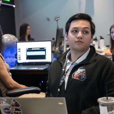 Jared Ralleta at his desk in Mission Control