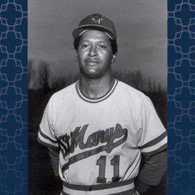 Baseball Coach Miles McAfee with a blue patterned background