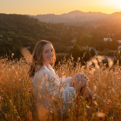 Jacquelyn Neuner on hillside overlooking Saint Mary's at sunset