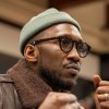Mahershala with glasses, hat and jacket