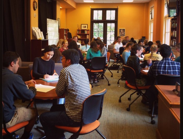 A view of the Writing Center full of writers, Writing Advisers, and Writing Circle Facilitators