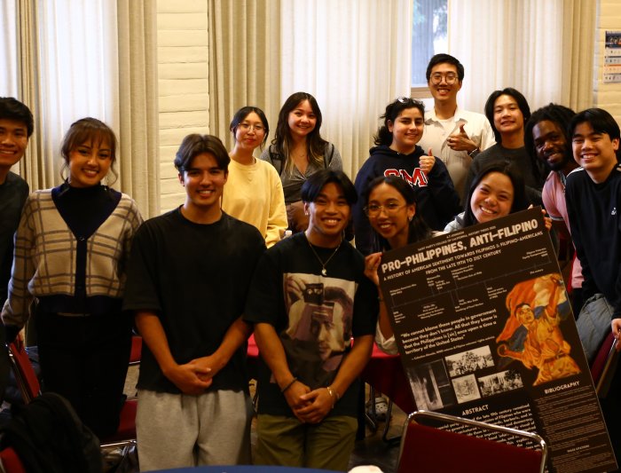 Image of students posing at their final history poster presentation