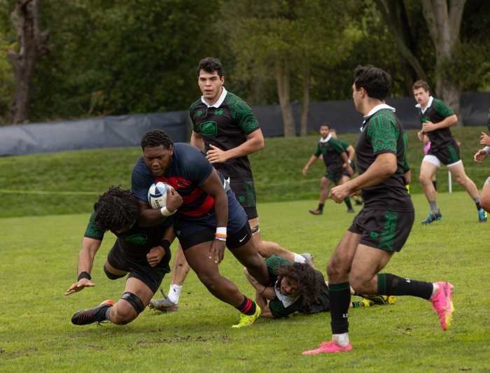 John- Henry Rouse drives through the Utah Valley defensive line during the Men's Rugby Game
