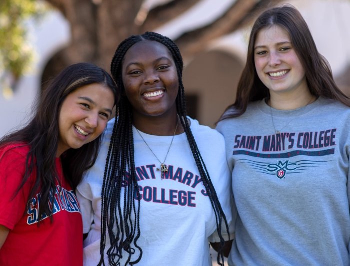 three female students smiling - from Weekend of Welcome 2024