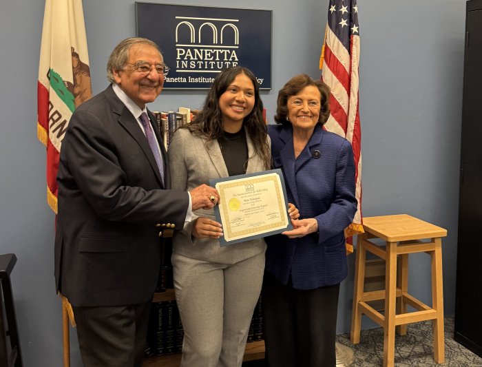 Leon and Sylvia Panetta and Rose Velasquez pose for a photo