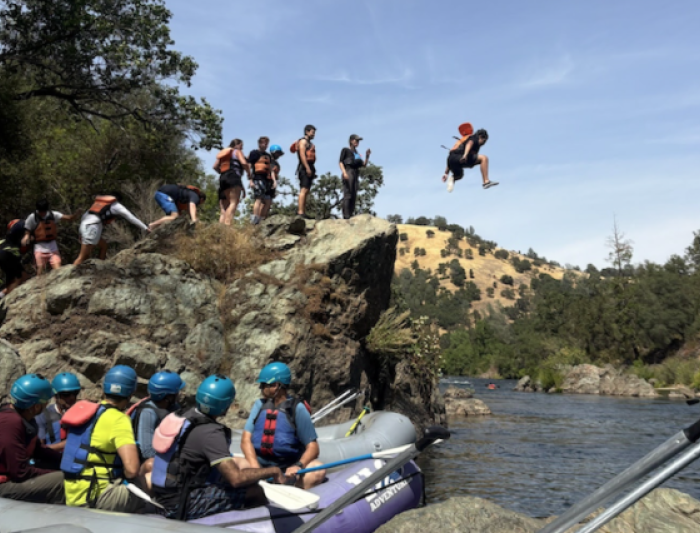 Leaping into adventure! Eric Garcia ’28 takes the plunge to cool off in the river. / Photo courtesy of Cassie Hernandez '27