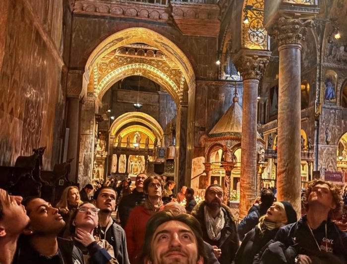 Students looking up in a cathedral