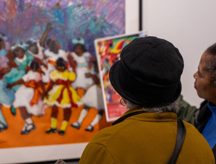 image of museum visitors looking at pastel work of art