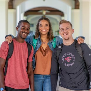 three students in hallway