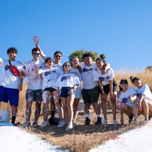 Students standing together after painting the SMC