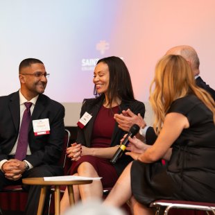 Nishant and Holly Joshi interviewed on stage at the Alumni Awards Ceremony