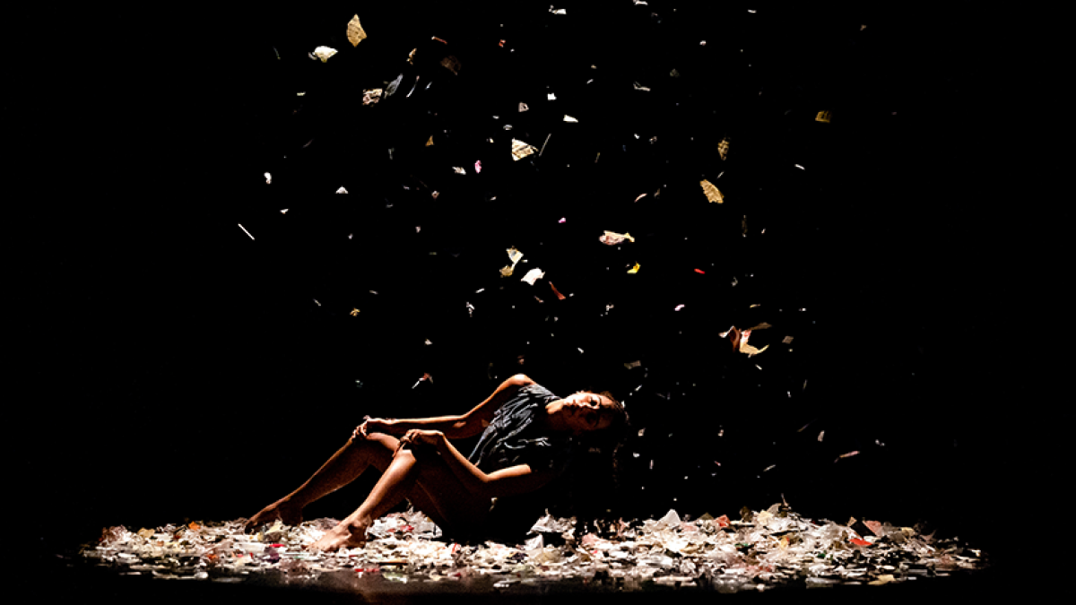 Dancer on stage with confetti falling