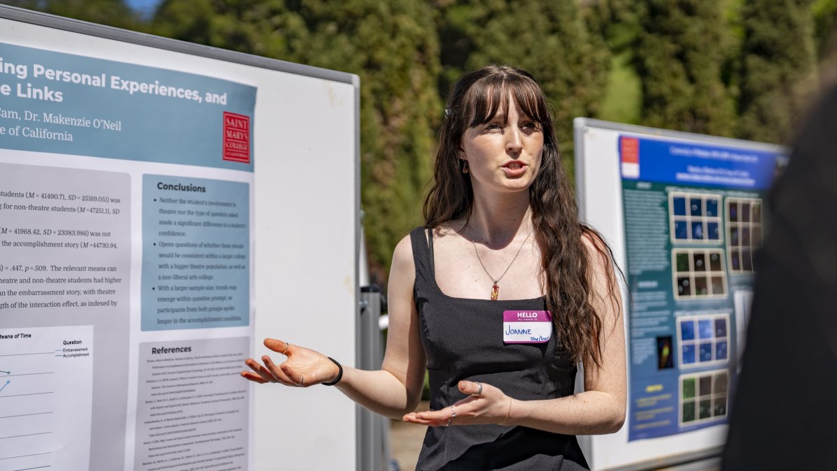 Student presenting research at a conference outside